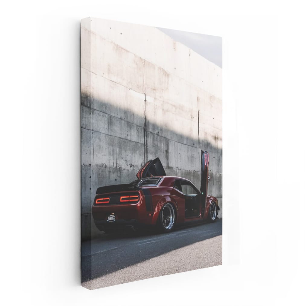 Red Dodge Beside Concrete Wall - Bold and Powerful Ride