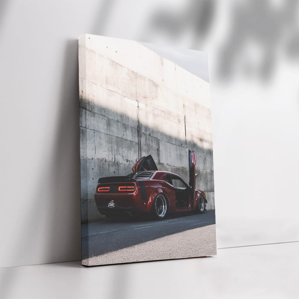 Red Dodge Beside Concrete Wall - Bold and Powerful Ride