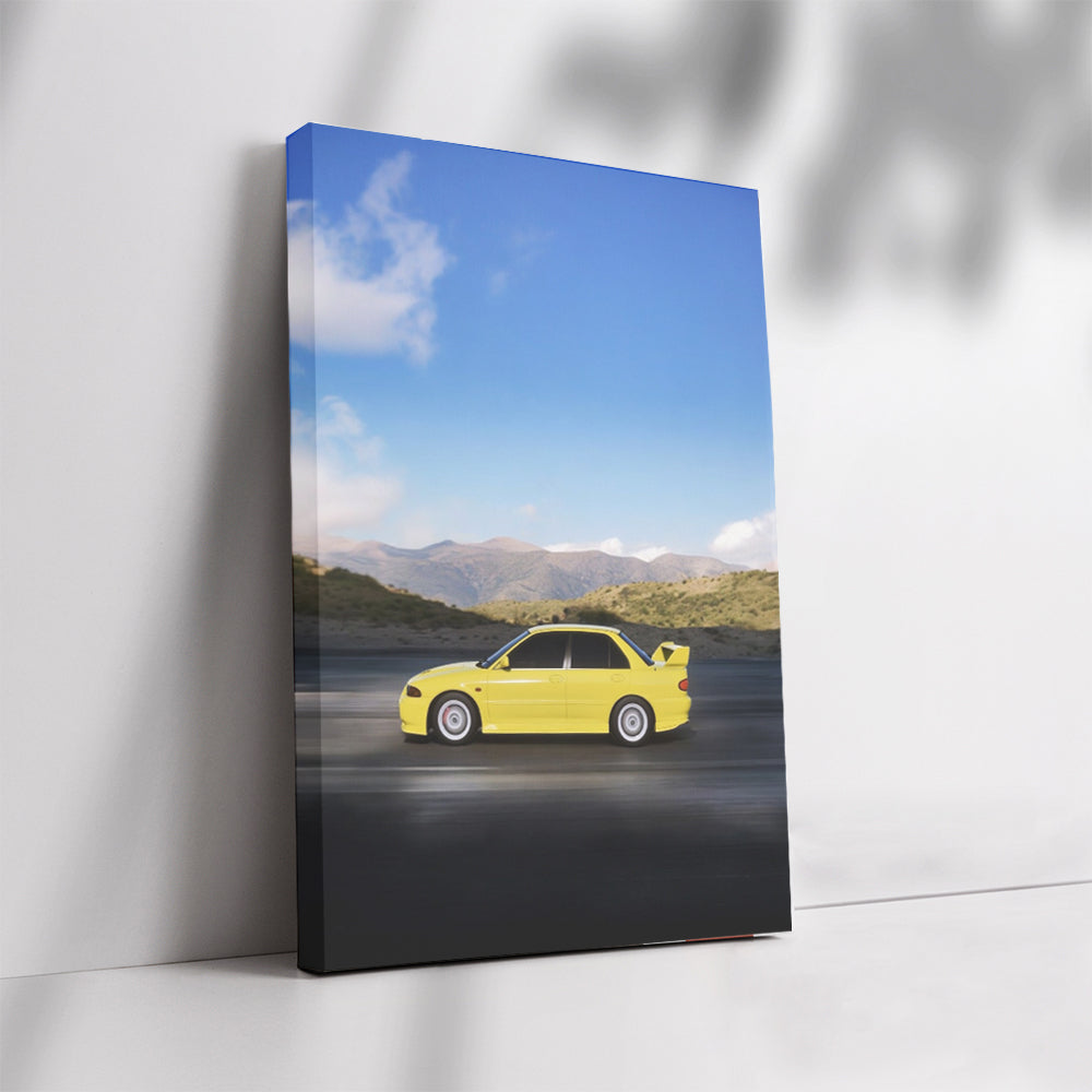 Yellow Mitsubishi Lancer navigating mountain roads - Agile Spirit