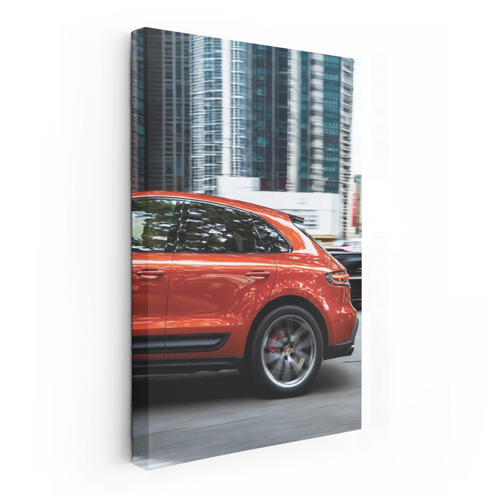 Porsche Macan S in Orange Amidst Skyscrapers - Urban Elegance